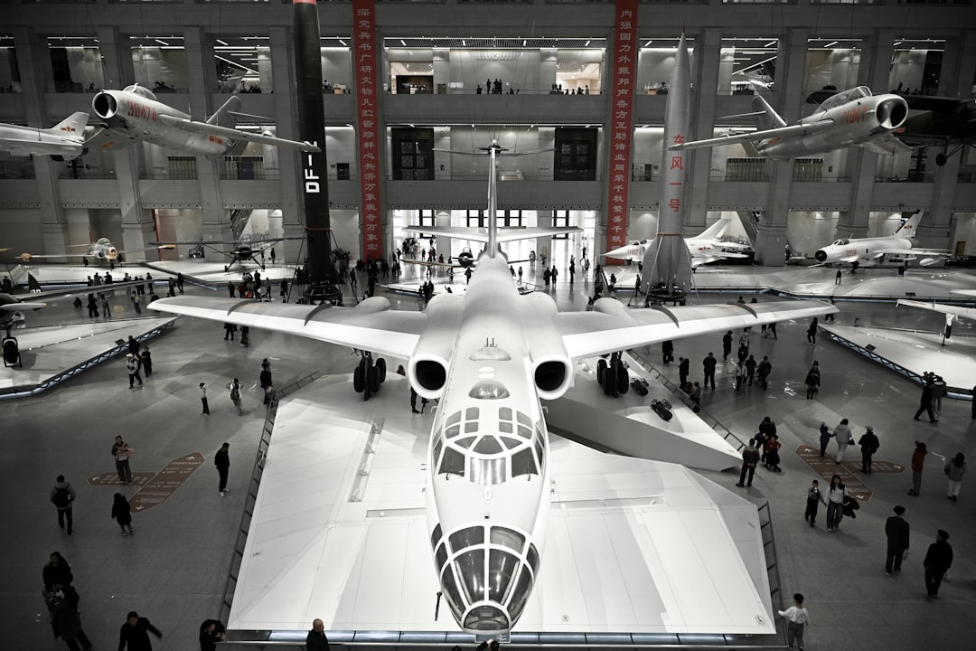 Visitors viewing an aircraft displayed in an aviation museum